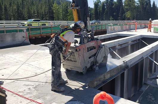 Picture of CanWest team member slab sawing
